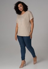 Kremowa bluzka XXL ze srebrnym motywem Kremowa bluzka XXL ze srebrnym motywem